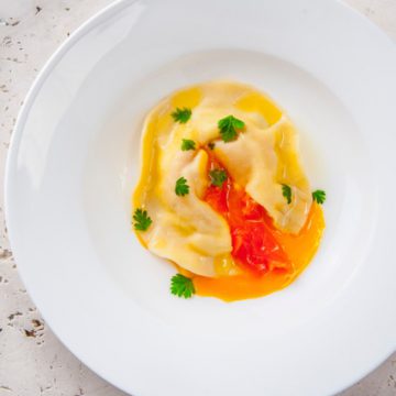 Cold Smoked Ocean Trout Ricotta and Soft Egg Yolk Ravioli with Lemon Oil and Parsley